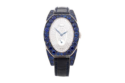 Lot 10 - A CHOPARD 'CLASSIQUE FEMME' 18CT WHITE GOLD SAPPHIRE AND DIAMOND LADIES WRISTWATCH
