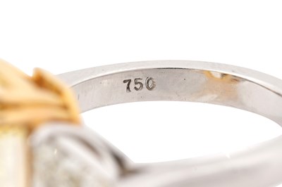 Lot 40 - A FANCY INTENSE YELLOW DIAMOND AND DIAMOND RING