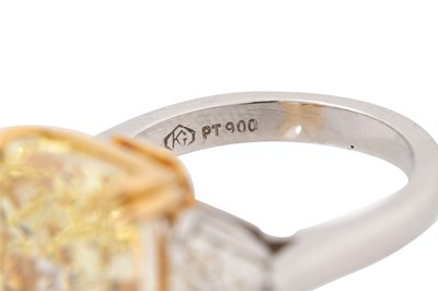 Lot 40 - A FANCY INTENSE YELLOW DIAMOND AND DIAMOND RING