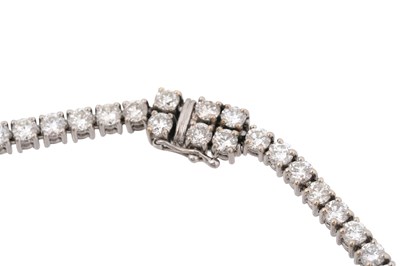 Lot 15 - AN 18CT WHITE GOLD DIAMOND TENNIS NECKLACE WITH AN ART DECO STYLE DIAMOND AND SAPPHIRE PENDANT