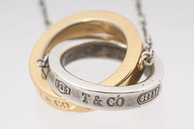 Lot 25 - A TIFFANY & CO. STERLING SILVER AND 18CT ROSE GOLD 'INTERLOCKING CIRCLES' PENDANT NECKLACE