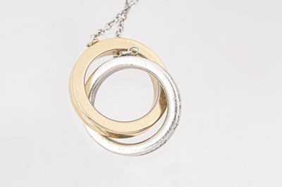 Lot 25 - A TIFFANY & CO. STERLING SILVER AND 18CT ROSE GOLD 'INTERLOCKING CIRCLES' PENDANT NECKLACE