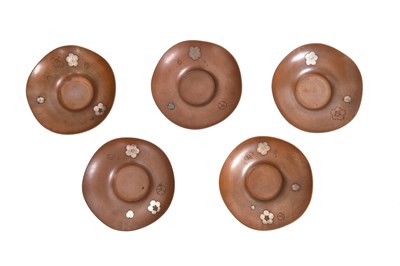 Lot 457 - A SET OF FIVE SILVER-DECORATED BRONZE 'SAKURA' SAUCERS, CHATAKU BY ISHIKAWA KATUSNOBU (1869 —)
