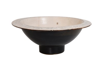 Lot 10 - A CIZHOU WARE CARVED 'PEONY' BOWL