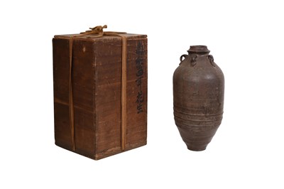Lot 15 - A BROWN-GLAZED POTTERY JAR