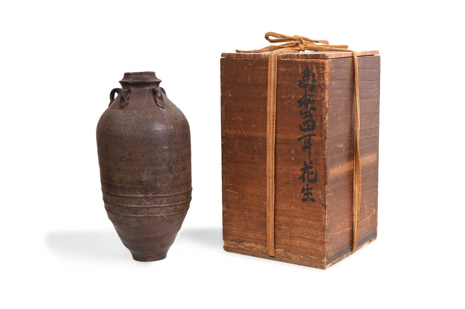 Lot 15 - A BROWN-GLAZED POTTERY JAR
