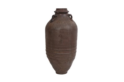 Lot 15 - A BROWN-GLAZED POTTERY JAR