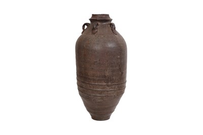 Lot 15 - A BROWN-GLAZED POTTERY JAR