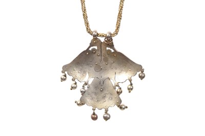 Lot 54 - A HIGH-TIN WHITE METAL ENCRUSTED PENDANT WITH DOUBLE-HEADED EAGLE
