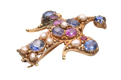 Lot 56 - A GILT EAGLE BROOCH SET WITH RUBIES, SAPPHIRES AND PEARLS