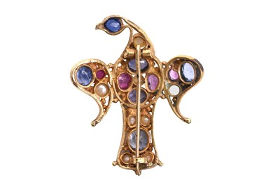 Lot 56 - A GILT EAGLE BROOCH SET WITH RUBIES, SAPPHIRES AND PEARLS