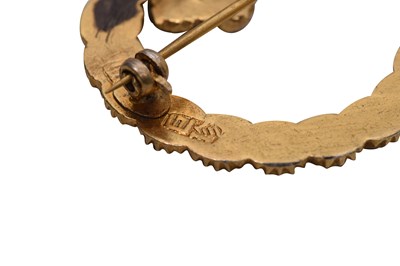 Lot 59 - THREE ENCRUSTED PARCEL-GILT BROOCHES