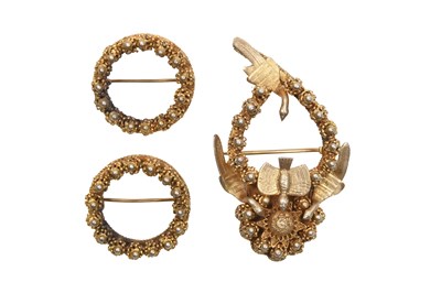 Lot 57 - THREE PARCEL-GILT BROOCHES WITH DOVES AND ROSES