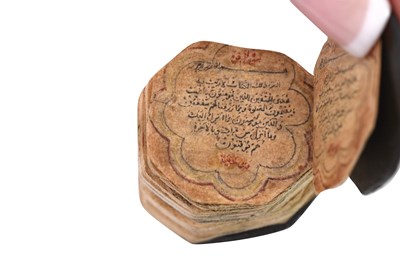 Lot 123 - AN ILLUMINATED OCTAGONAL MINIATURE QUR'AN