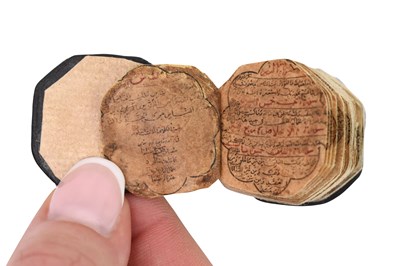 Lot 123 - AN ILLUMINATED OCTAGONAL MINIATURE QUR'AN