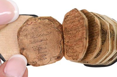 Lot 123 - AN ILLUMINATED OCTAGONAL MINIATURE QUR'AN
