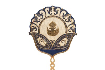 Lot 50 - A PIERCED, GILT AND PAINTED HIDE FAN WITH HORN HANDLE