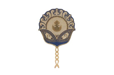 Lot 50 - A PIERCED, GILT AND PAINTED HIDE FAN WITH HORN HANDLE