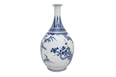 Lot 73 - A LARGE BLUE AND WHITE ARITA 'PRUNUS AND BAMBOO' BOTTLE VASE