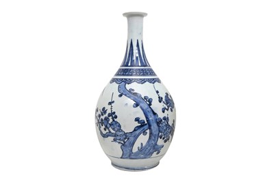 Lot 73 - A LARGE BLUE AND WHITE ARITA 'PRUNUS AND BAMBOO' BOTTLE VASE