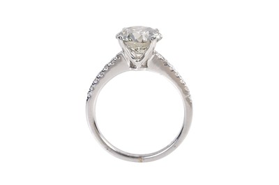 Lot 84 - A SOLITAIRE DIAMOND-SET 18K WHITE GOLD ENGAGEMENT RING