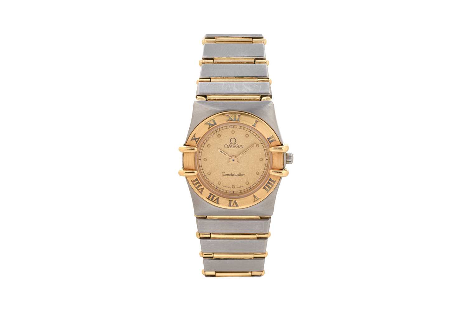 Lot 9 - A LADIES 18K YELLOW GOLD AND STAINLESS STEEL QUARTZ BRACELET WATCH.