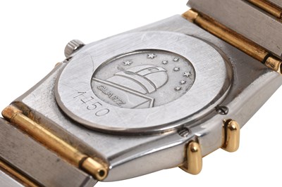 Lot 9 - A LADIES 18K YELLOW GOLD AND STAINLESS STEEL QUARTZ BRACELET WATCH.