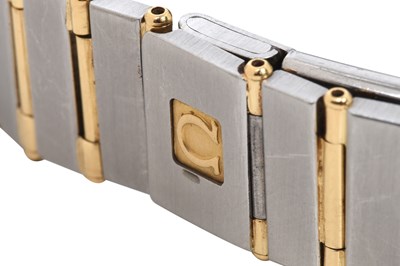 Lot 9 - A LADIES 18K YELLOW GOLD AND STAINLESS STEEL QUARTZ BRACELET WATCH.