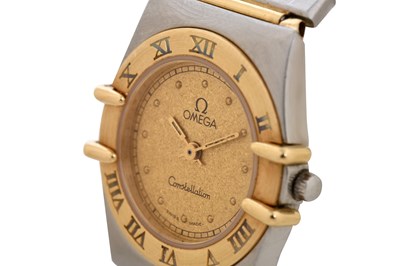 Lot 9 - A LADIES 18K YELLOW GOLD AND STAINLESS STEEL QUARTZ BRACELET WATCH.